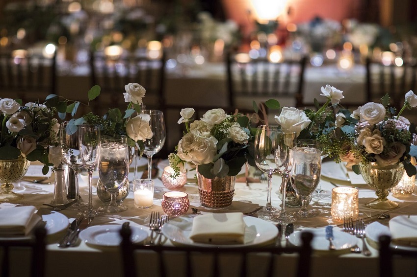 Centerpieces with natural flowers and candles